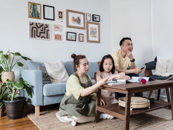 A family relaxing together at home after a CFox pest treatment